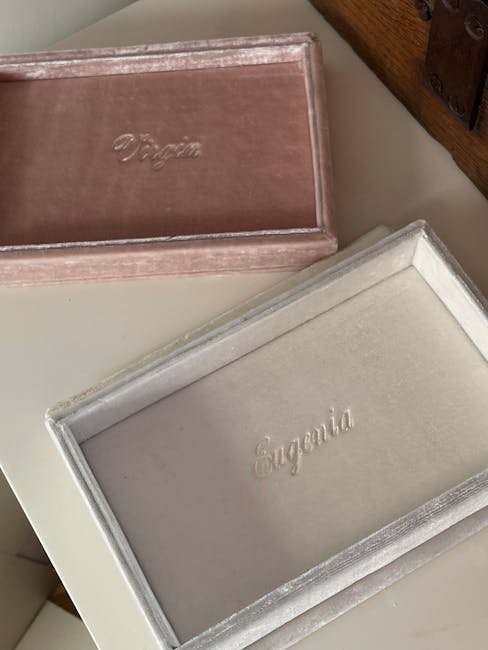 A pearl necklace coiled flat inside a silk pouch, clasp fastened, ready for storage